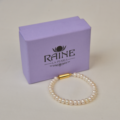 <div style="font-family: 'Georgia', serif; color: #333; line-height: 1;">   <h2 style="color: #b88e56; font-size: 0.8em; letter-spacing: 2px;  margin-bottom: 15px;">The Pure Radiance Pearl Bracelet</h2></div>